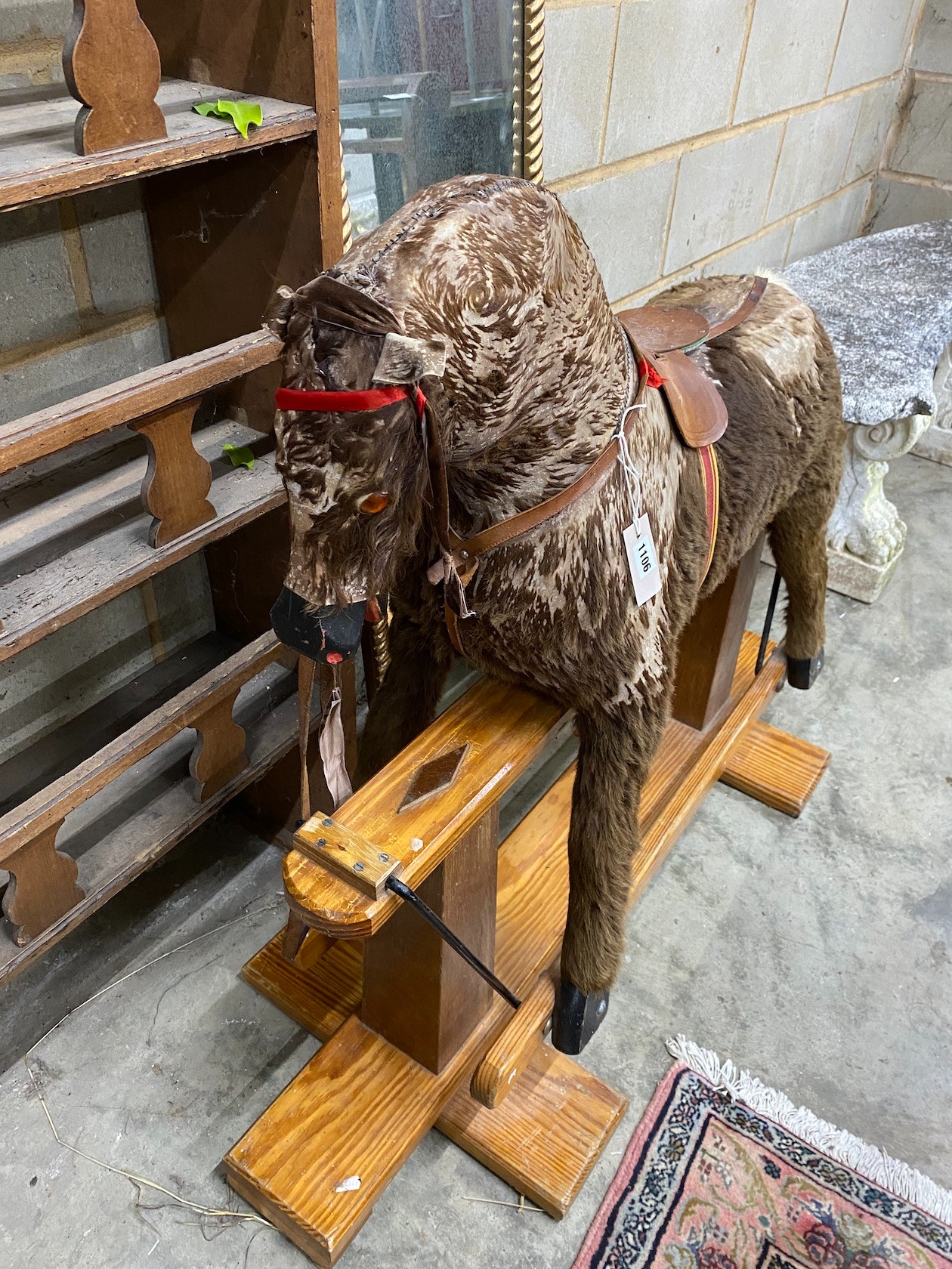 A modern rocking horse on a pine underframe, 112 cm long